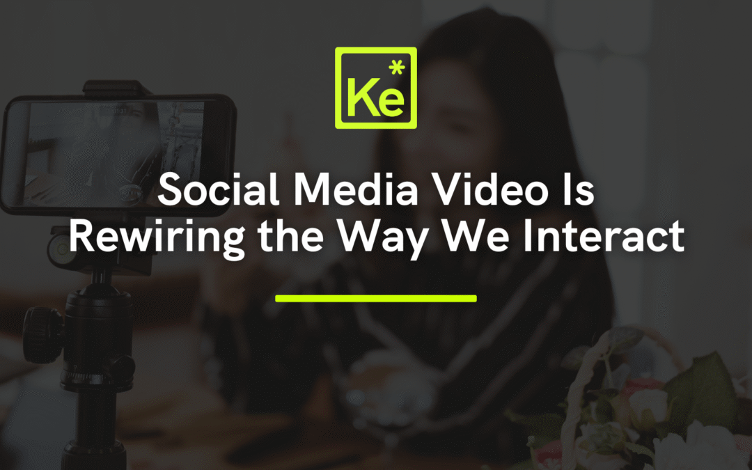 Person filming vertical video on smartphone, illustrating social media video production trends